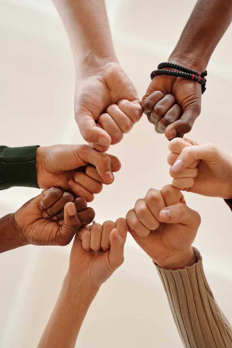 Close-up of People Bumping Fists 